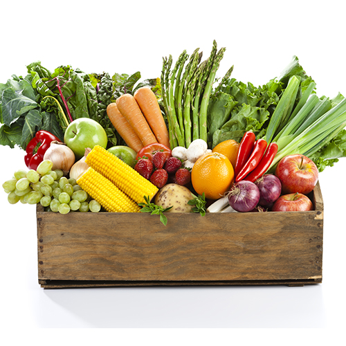 a box containing fresh vegetables; carrots tomatoes, asparagus, corn and others