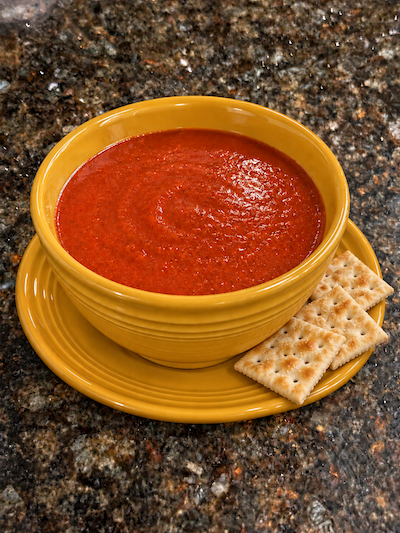 Homemade tomato soup in a butterscotch colored Fiesta Ware bowl